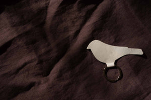 Textured gold bird keychain, handcrafted leather key ring, modern and elegant keychain for everyday use.