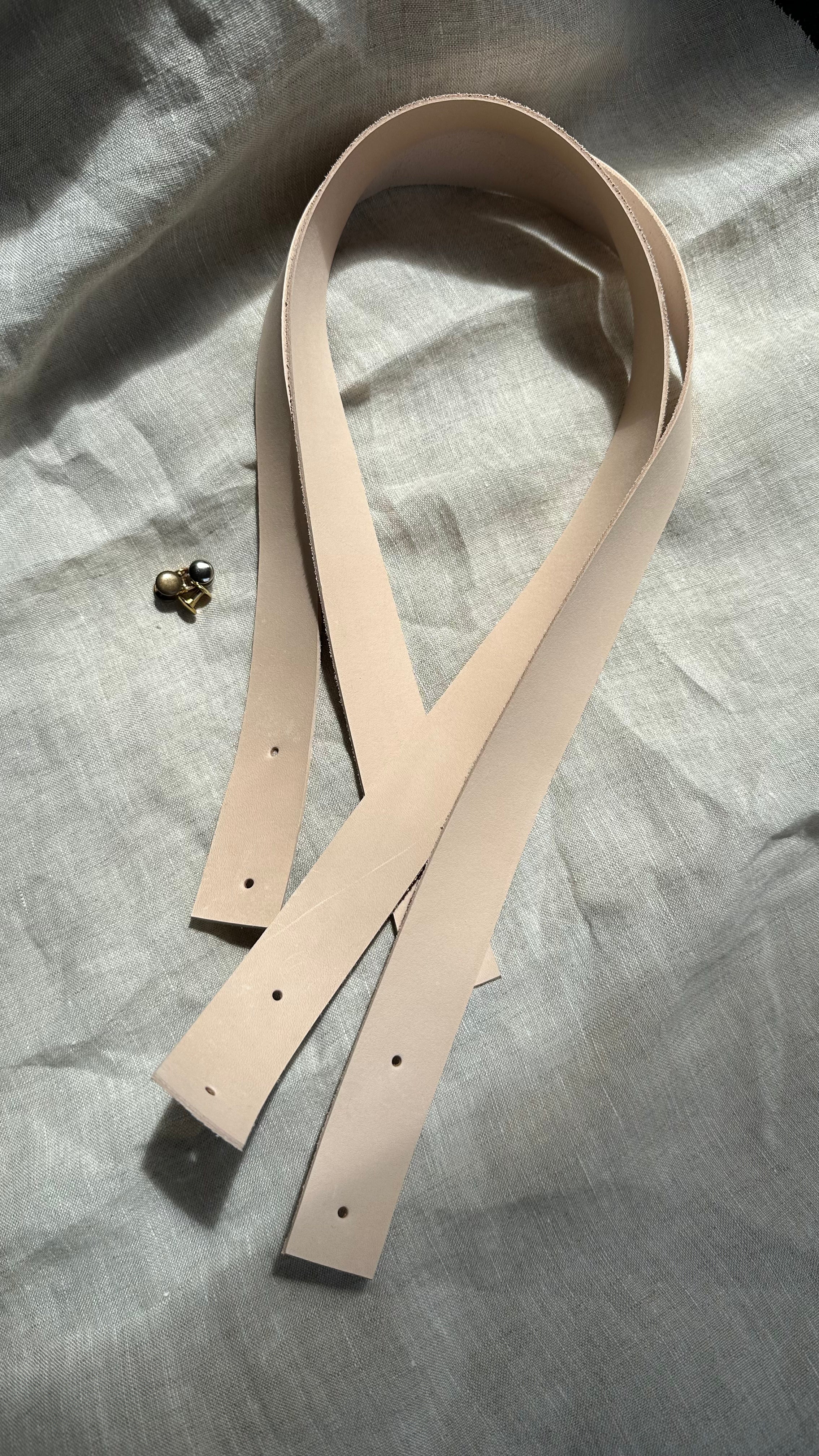 Natural leather handles with holes, perfect for DIY projects. Includes brass hardware