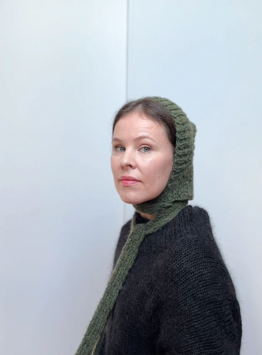 Green knitted bonnet made of soft mohair, handmade winter hat with ties, warm and cozy accessory for women, perfect as a unique gift for cold seasons
