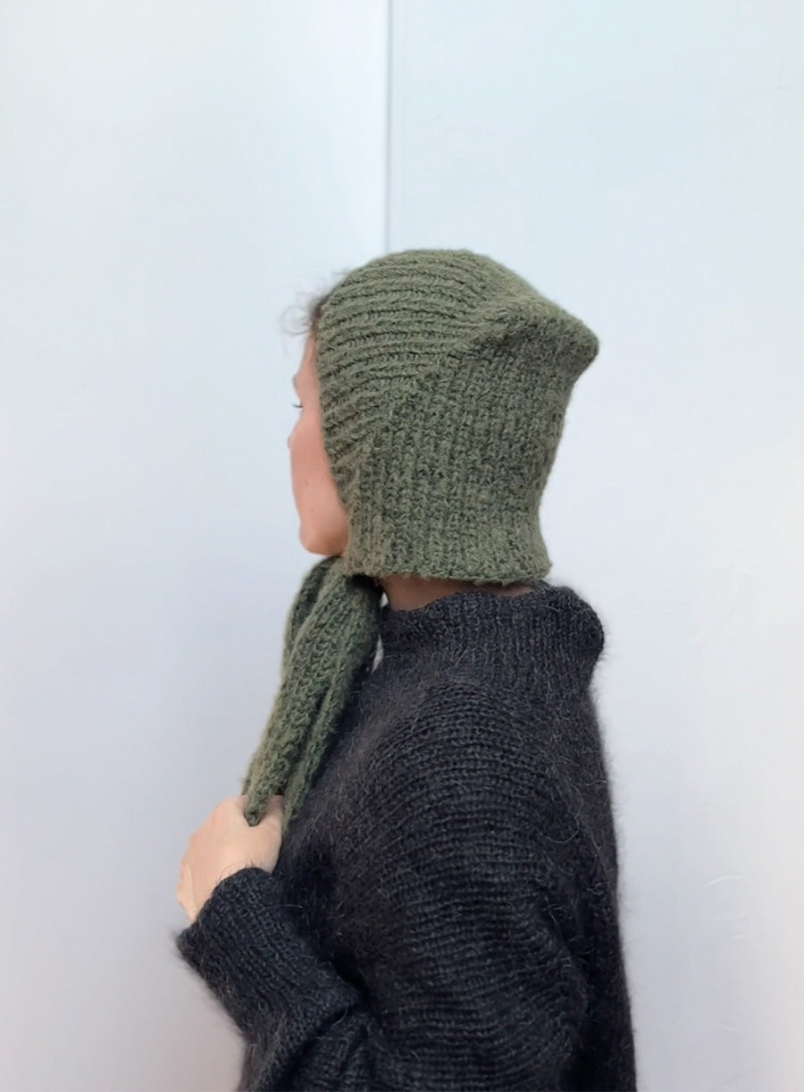 Vintage green mohair hat with ties, handmade knitted bonnet for women, soft, fluffy, and stylish, perfect for winter walks, layering, and cozy cold weather outfits.