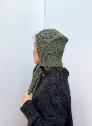 Vintage green mohair hat with ties, handmade knitted bonnet for women, soft, fluffy, and stylish, perfect for winter walks, layering, and cozy cold weather outfits.