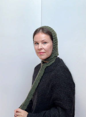 Mohair knitted bonnet in olive green, soft and warm handmade hat with ties, cozy women’s accessory for winter and fall outfits, ideal for unique gift lovers.