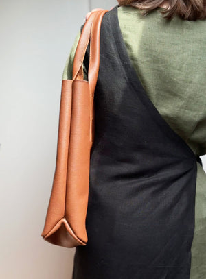 Close-up of the leather texture in brown, emphasizing the high-quality material and craftsmanship