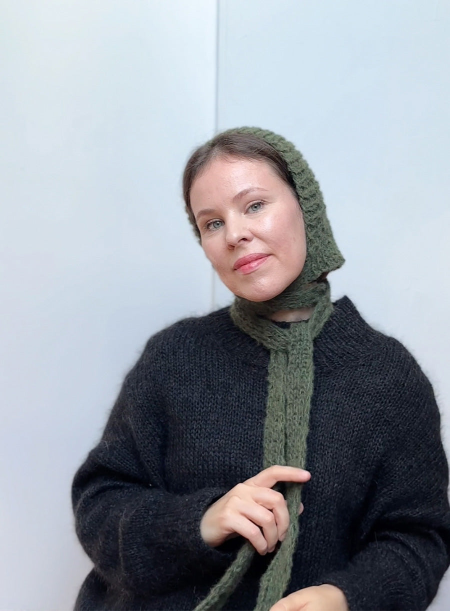 Hand-knitted mohair bonnet in forest green, soft and elegant winter hat with ties, stylish and comfortable handmade accessory for fall and winter looks