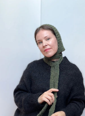 Hand-knitted mohair bonnet in forest green, soft and elegant winter hat with ties, stylish and comfortable handmade accessory for fall and winter looks